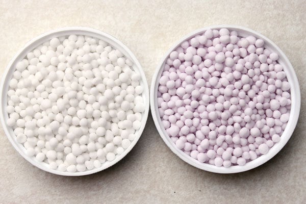 Coated urea fertilizer (fertiliser) before and after coating in a coating drum