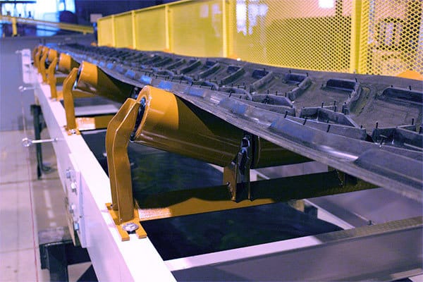 Belt Conveyor with Cleated Belting on Steel Roll Carrying Idlers