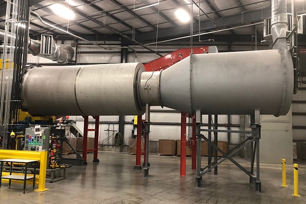 Combustion chamber on a rotary dryer