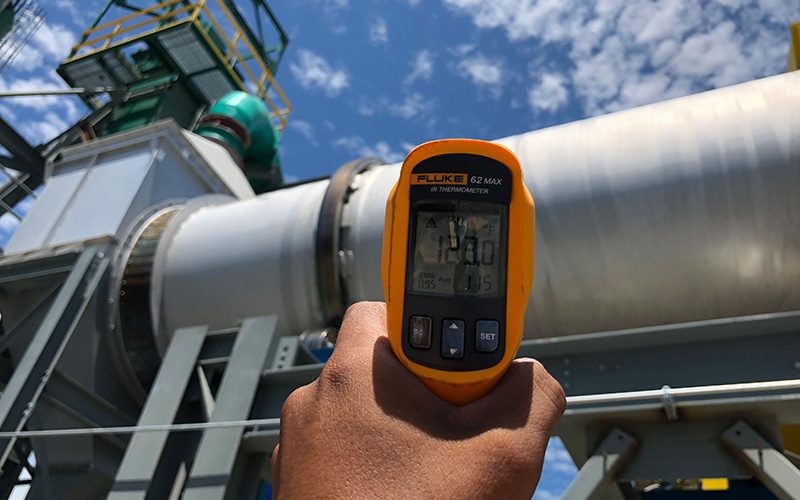 Using a temperature gun to check shell temperature